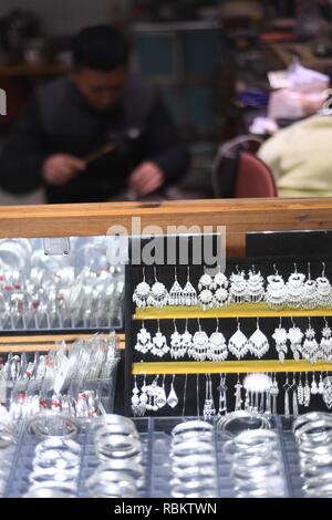 Qiandongnan. 11th Jan, 2019. A craftsman makes silver accessories in Kaili City, southwest China's Guizhou Province, Jan. 10, 2019. People are busy making silver handicrafts for the upcoming Spring Festival, which starts from the first day of the first month of the Chinese lunar calendar, or Feb. 5 this year. Credit: Xinhua/Alamy Live News Stock Photo