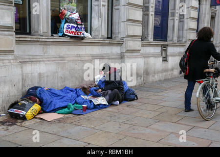 London, UK. 11th Jan, 2019. A homeless man seen sleeping on a pavement in Piccadilly Circus. Credit: Dinendra Haria/SOPA Images/ZUMA Wire/Alamy Live News Stock Photo