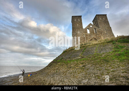 Reculver, Kent, UK. 11th Jan, 2019. Sightseers brave cold and damp weather at the imposing ruins of Reculver medieval church on the Thames Estuary, Herne Bay, Kent. Credit: Peter Cripps/Alamy Live News Stock Photo