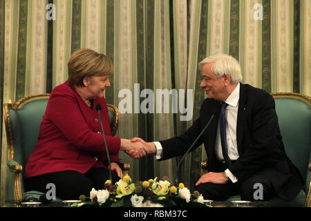 Athens, Greece. 11th Jan, 2019. Greek President Prokopis Pavlopoulos (R) shakes hands with German Chancellor Angela Merkel at the Presidential Mansion in Athens, Greece, on Jan. 11, 2019. Germany's support to Greece during the difficult bailout period from 2010 until August 2018, as well as in the post-bailout era, is support to the EU's cohesion, Greek President Prokopis Pavlopoulos said on Friday, welcoming German Chancellor Angela Merkel to Athens. Credit: Marios Lolos/Xinhua/Alamy Live News Stock Photo