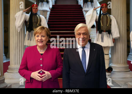 Athens, Greece. 11th Jan, 2019. Greek President Prokopis Pavlopoulos (R) and German Chancellor Angela Merkel pose for photos at the Presidential Mansion in Athens, Greece, on Jan. 11, 2019. Germany's support to Greece during the difficult bailout period from 2010 until August 2018, as well as in the post-bailout era, is support to the EU's cohesion, Greek President Prokopis Pavlopoulos said on Friday, welcoming German Chancellor Angela Merkel to Athens. Credit: Marios Lolos/Xinhua/Alamy Live News Stock Photo