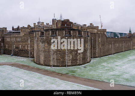 Snow in London. The roofs of Tower of London covered in fresh white snow. In the background the Shard, the tallest skyscraper in Europe. Stock Photo