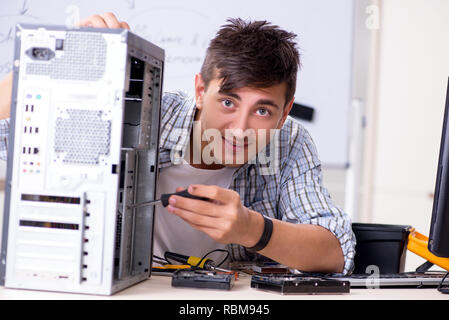 Young it specialist in front of the whiteboard Stock Photo
