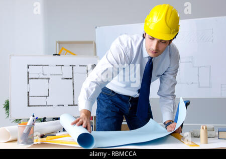 Young handsome architect working on the project Stock Photo