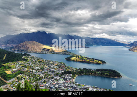 Beautiful view of Queenstown and lake Wakatipu from the hill on a cloudy weather