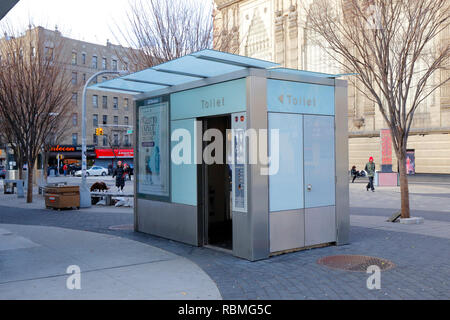 An automatic self cleaning public pay toilet, at La Plaza de Las Americas in Manhattan's Washington Heights, New York. This one out of order Stock Photo