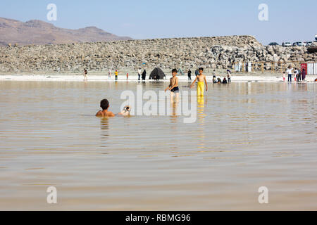 People are swimming in the salt Urmia Lake, West Azerbaijan province, Iran Stock Photo