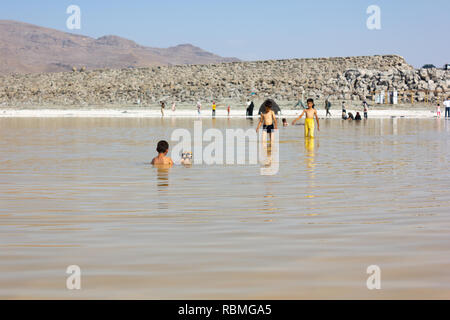 People are swimming in the salt Urmia Lake, West Azerbaijan province, Iran Stock Photo