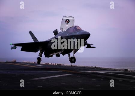 ARABIAN SEA – An F-35B Lightning II assigned to Marine Fighter Attack Squadron 211 (VMFA), 13th Marine Expeditionary Unit (MEU), makes final preparations to land aboard the Wasp-class amphibious assault ship USS Essex (LHD 2), Jan. 9, 2019. The Essex is the flagship for the Essex Amphibious Ready Group and, with the embarked 13th MEU, is deployed to the U.S. 5th Fleet area of operations in support of naval operations to ensure maritime stability and security in the Central Region, connecting the Mediterranean and the Pacific through the western Indian Ocean and three strategic choke points. (U Stock Photo