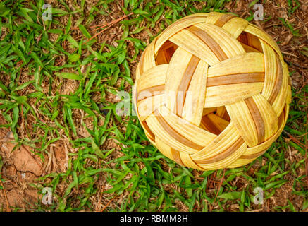 Sepak Takraw ball - rattan ball sport outdoor / Sepak takraw on green grass field Stock Photo