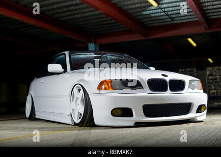 Stanced BMW E46 3 series lowered on air bag suspension and modified Stock Photo