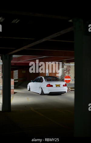 Stanced BMW E46 3 series lowered on air bag suspension and modified Stock Photo