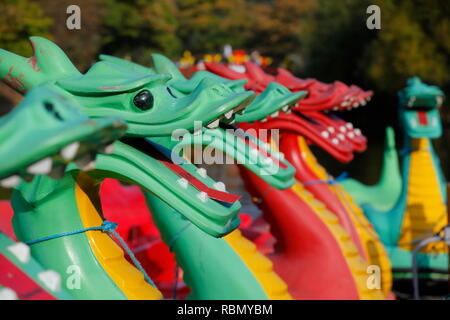 Dragon pedalos moored in Peasholm Park in Scarborough,North Yorkshire Stock Photo