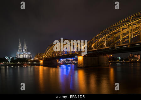 scenic view on illuminated Cologne Cathedral with bridge in foreground Stock Photo