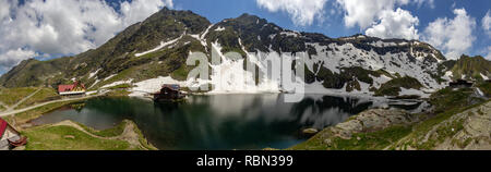 Balea Lake is a glacial lake in the Faragas Mountains at the Transfagaras highway pass Stock Photo