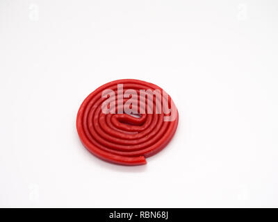 Red licorice on white background Stock Photo