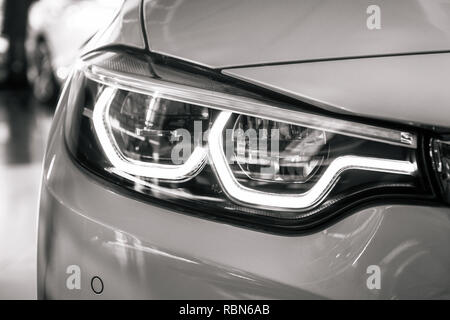 Munich, Germany - December 7, 2017: Headlight close-up of BMW 430 cabriolet sports car Stock Photo
