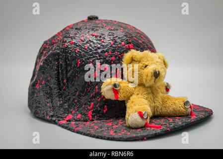 Bear figure doll on a hat, isolated on white background Stock Photo