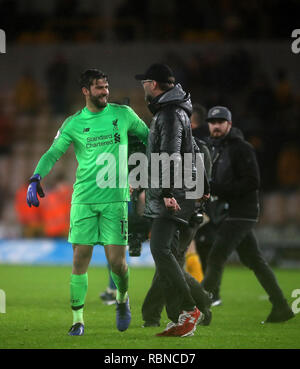 Liverpool goalkeeper Alisson Becker celebrates his side's first goal ...