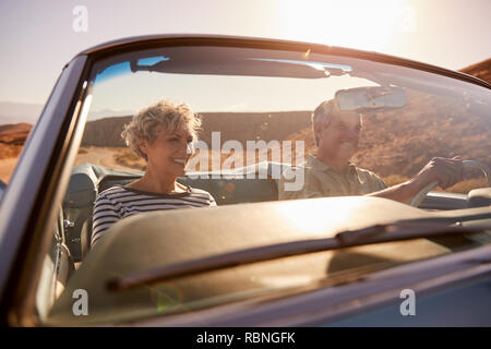 Couple on road trip, seen through car windscreen, close up Stock Photo