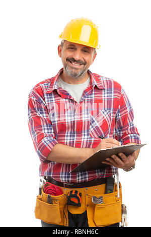 Friendly constructor smiling as taking notes on clipboard isolated on white studio background Stock Photo