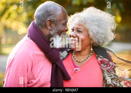 Senior Couple On Autumn Walk In Countryside Together Stock Photo
