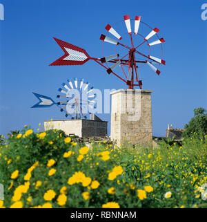 Colourful farm windmills near Palma de Mallorca Airport with spring flowers, Can Pastilla, Majorca (Mallorca), Balearic Islands, Spain, Europe