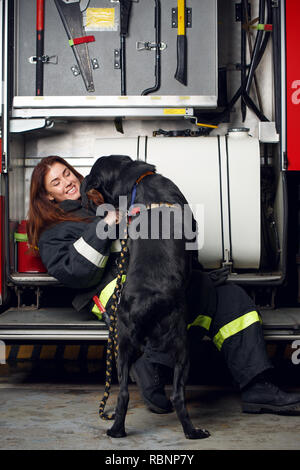 Sexy sensual female firefighter with a red fire extinguisher Stock ...