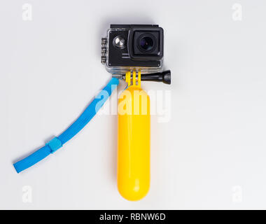Action Camera in Water Proof case with floating stick Stock Photo