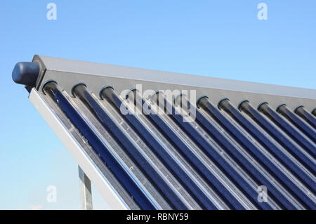 Solar water heating (SWH) systems use solar panels, called collectors, fitted to your roof. Solar thermal collector with dust need to clean. Energy ef Stock Photo
