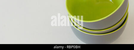 Three isolated green grey bowls on white background, space for text Stock Photo