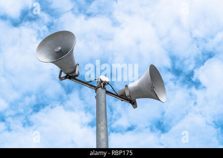 Vintage loudspeakers against cloudy blue sky. Space for your creative text. Stock Photo