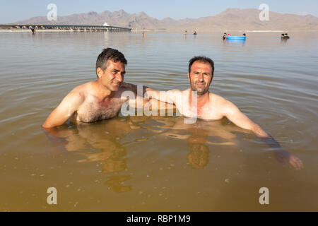 People are swimming in the salt Urmia Lake, West Azerbaijan province, Iran Stock Photo