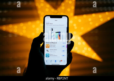PARIS, FRANCE - NOV 10, 2017: Apple Sore app the new Apple iPhone x smartphone telephone  Stock Photo
