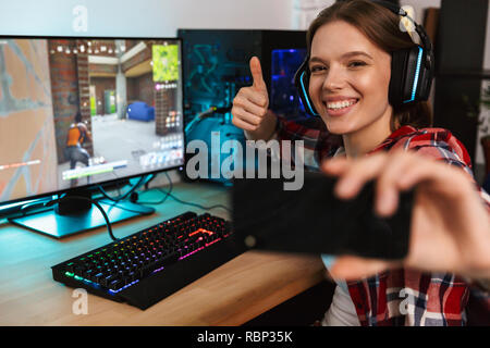 Excited Girl Gamer Sitting at the Table, Playing Online Games Stock Image -  Image of headset, esports: 136171701