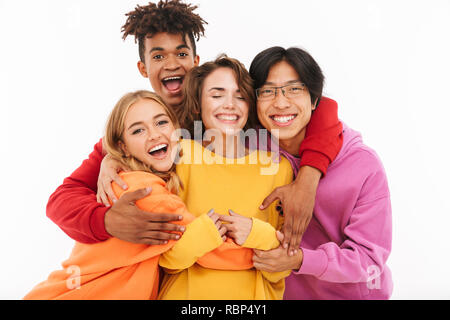 Group of cheerful teenagers isolated over white background, hugging Stock Photo