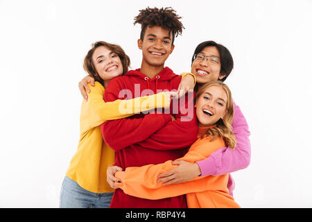 Group of cheerful teenagers isolated over white background, hugging Stock Photo