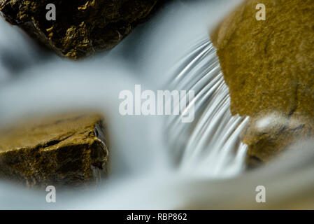 scenic waterfall in an river in bright light Stock Photo