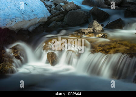 scenic waterfall in an river in bright light Stock Photo