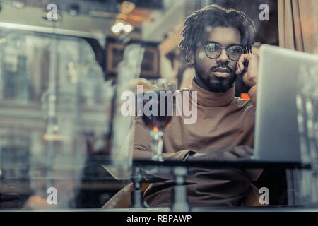 Hard-working stylish man being deep in thoughts Stock Photo