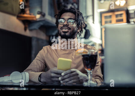 Delighted international man being deep in thoughts Stock Photo
