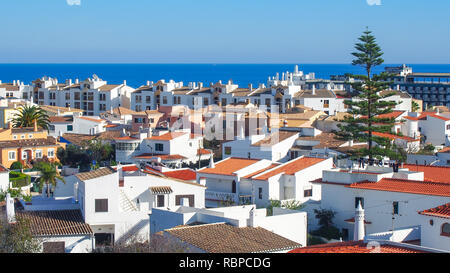 Small white houses with orange roofs, Atlantic Ocean on horizon, Lagos< Portugal Stock Photo