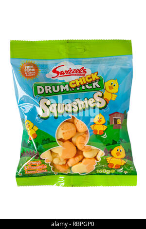 bag of Swizzels Drumchick Squashies, orange & pineapple flavour gums isolated on white background - ready for Easter Stock Photo