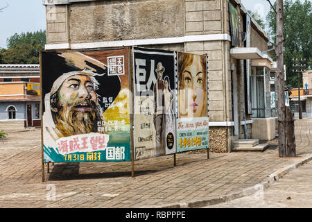 Pyongyang, North Korea - July 29, 2014: The Korean film Studio territory in Pyongyang. Billboard on a street. Stock Photo