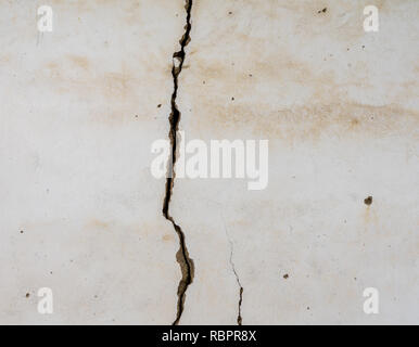 Large vertical crack in plastered wall Stock Photo
