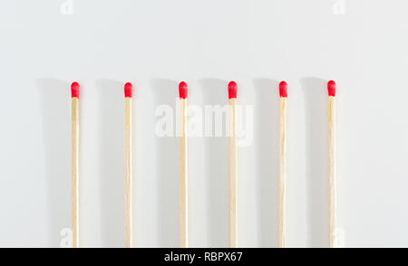 Many matches sticks for lighting a fire on white background. Stock Photo