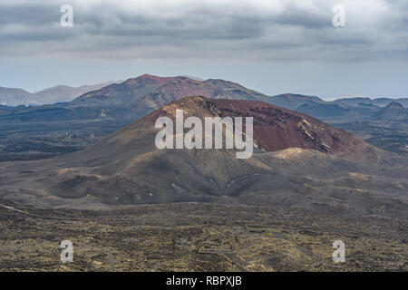 Volcanic cone  in the arid Timanfaya National Park, Lanzarote, Spain Stock Photo