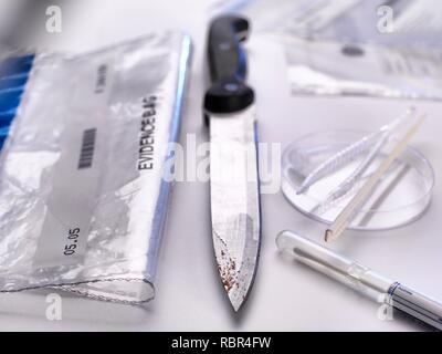 Forensic evidence collection. A knife about to be swabbed for DNA (deoxyribonucleic acid) and other forensic tests. Stock Photo