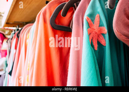 A Market stall in Puerto Banus, Marbella, Spain, selling colourful children  sized dresses Stock Photo - Alamy