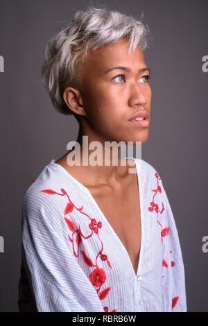 Young beautiful rebellious woman with short hair thinking Stock Photo